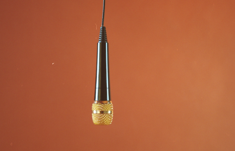Gold Microphone Hanging on Cable