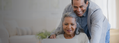 Couple using laptop to take advandtage of Collabria Welcome Points