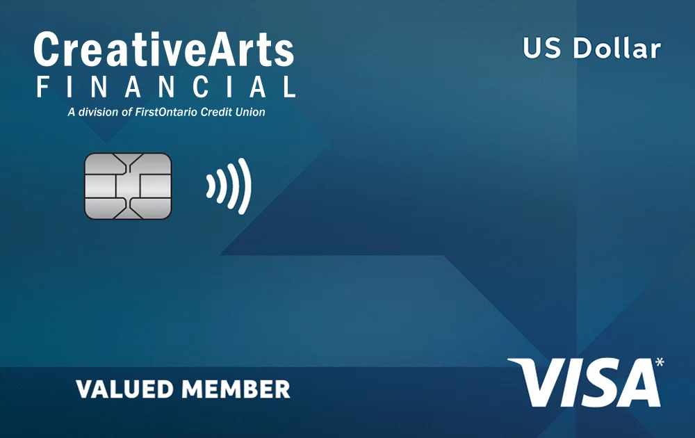 Student smiling in hallway holding backpack straps