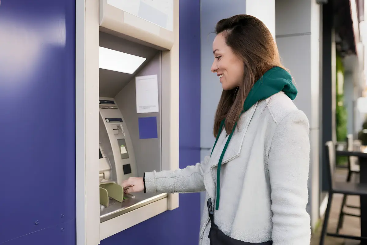 Artist painting outdoors on easel.