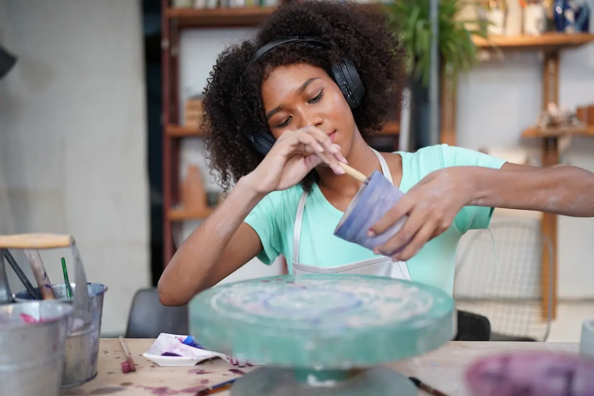 Artist working in a studio, highlighting how an emergency fund helps creatives stay focused on their craft without financial stress.