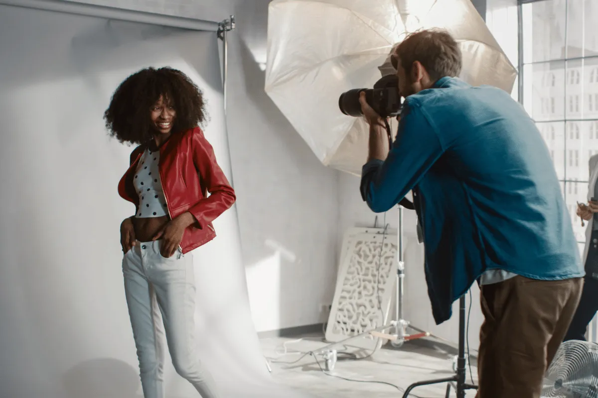 Actor participating in a professional photo shoot, representing contract‑based income and banking needs for actors.