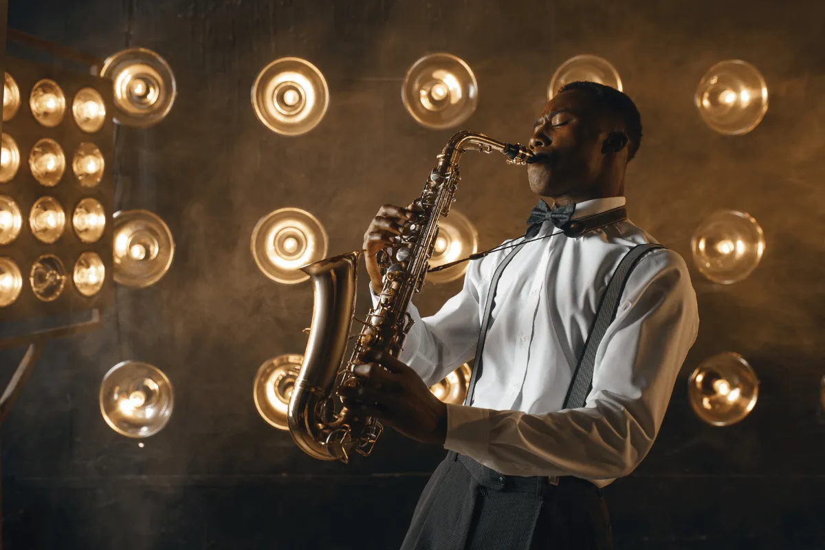 Professional musician performing live while building passive income and long-term financial stability with Creative Arts Financial.